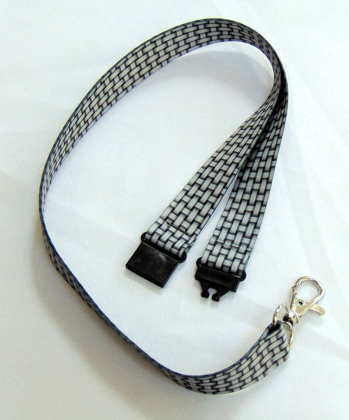 20mm silver grey lanyard with a printed weave effect pattern showing breakaway fittings